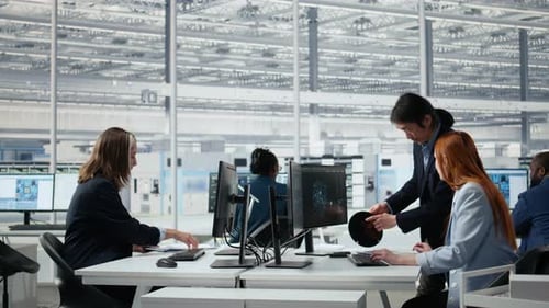 Diverse Engineers Working in a Modern Semiconductor Manufacturing Office