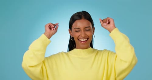 Excited, woman and dance for success in studio to celebrate party, promotion