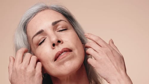 Woman Massaging Face for Skincare Routine