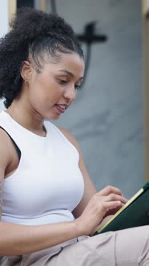 Young Black Woman Using a Digital Tablet at Home for Ecommerce