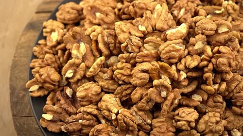 Walnut Pile on Dark Plate, Overhead Still Life