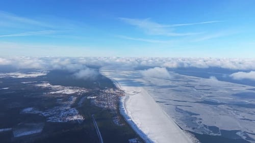 Frozen Sea Bay and Distant Winter Coastline