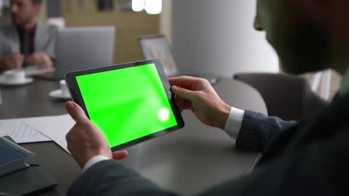 Business Man Using Digital Tablet Chroma Key Researching Financial Data on Conference