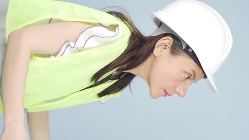 Vertical video of Engineer waving at camera.