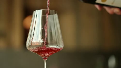 Red Wine Pouring into a Glass, Close Up