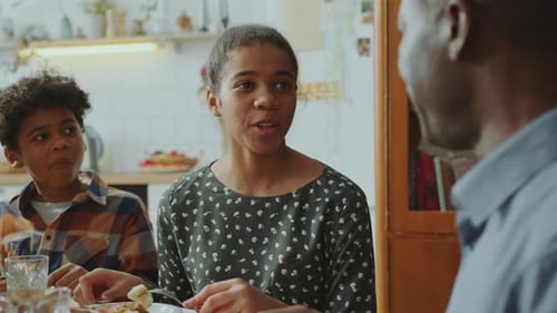 Family Sharing Meal and Conversation at Home