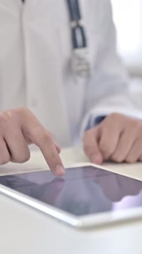 Doctor Using Tablet, vertical video