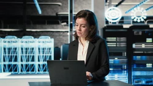 Data Center Female Programmer Uses Laptop and AR Virtualization