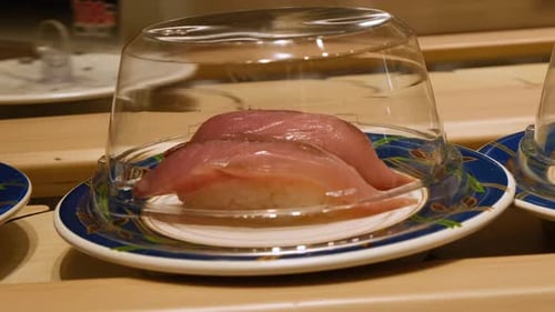 Conveyor belt sushi in Japanese restaurant