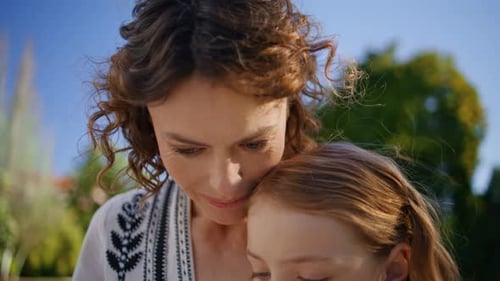 Closeup Mom Kid Bonding Resting Park on Sunny Lawn Happy Family Summer Weekend