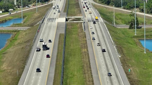 Above View of Wide Highway in Florida with Fast Driving Cars During Rush Hour USA Transportation