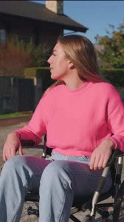 Young Woman in Wheelchair Outside on Sunny Day