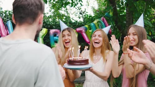 Friends Celebrate Birthday Party in Green Yard