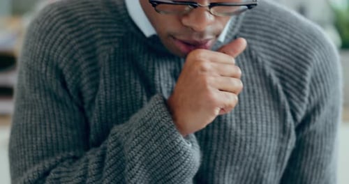 Man Coughing and Holding Chest in Pain