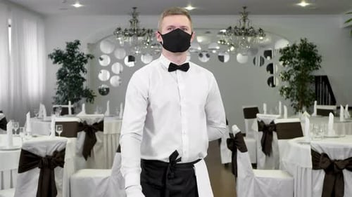 Man Wearing Mask Standing in a Wedding Venue