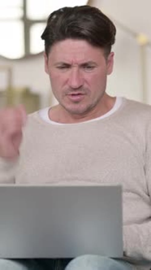 Man Using Laptop Experiences Neck and Shoulder Pain