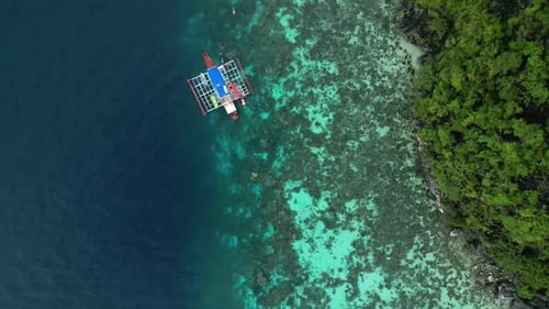 Tour Boat Floating Near Beautiful Island Shoreline