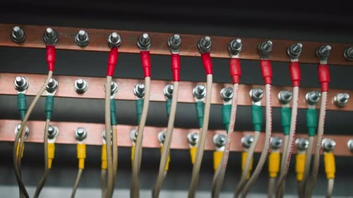 Different Color Wires Connected to Copper Earthing Bars