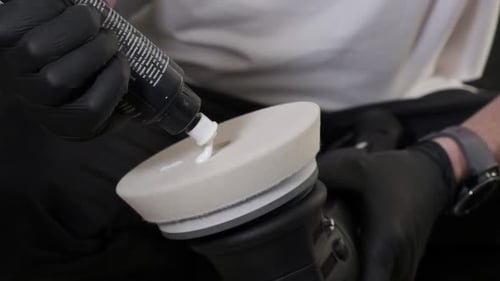 Man apllyaing car wax. Close up.