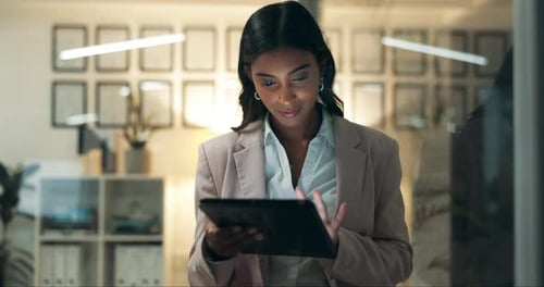 Business woman, research and night with tablet for trading, online browsing or investing at office
