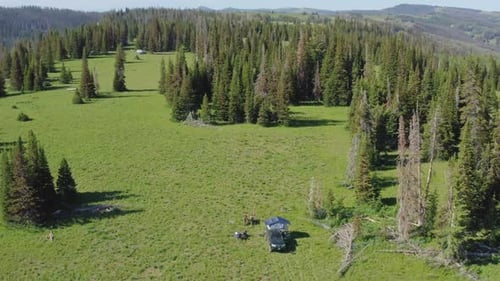 Orbiting panoramic view of a solitary camp site in the high Uinta mountains of Utah