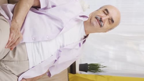 Vertical video of Old man in love is feeling happy.