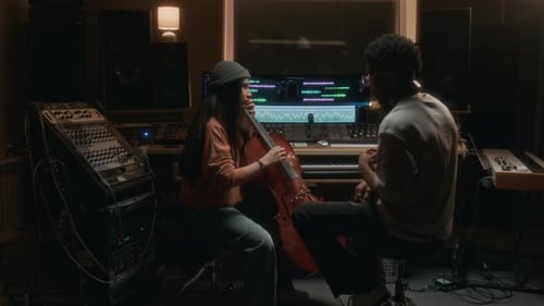 Girl Playing Cello in Recording Studio with Music Producer