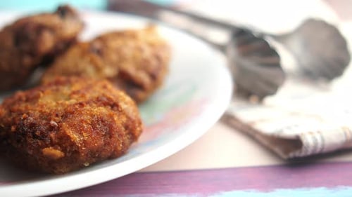 Golden Brown Fried Cutlets on White Plate
