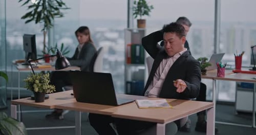 Focused People Working at Desks in Modern Office