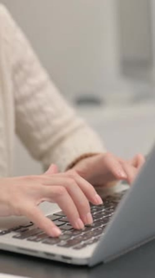 Close up of Female Hands Typing on Laptop
