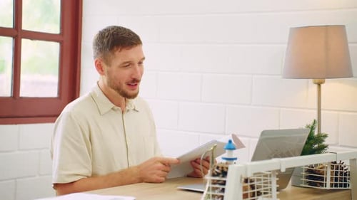 Man Holding Virtual Meeting From Home Office