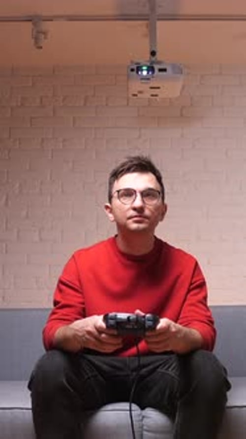 Man with Game Controller on Couch