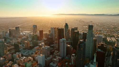 Distancing from the midtown of Los Angeles lit with bright sun.