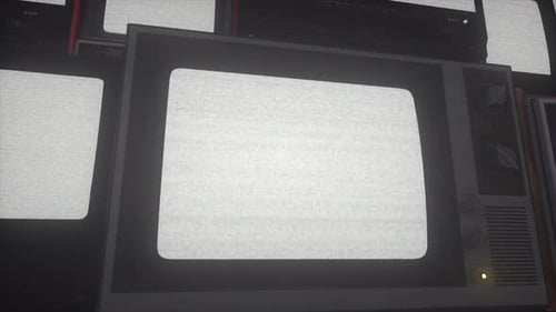 Old Analog TV Sets Displaying White Noise Interference in Dark Room
