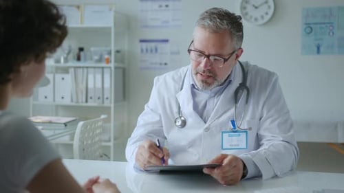 Doctor Consults with Patient in Bright Office