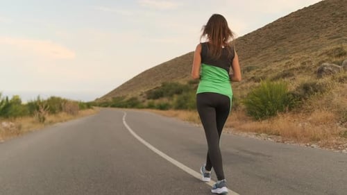 Rare View Woman Catches Her Breath Before Sprinting Listening to Music