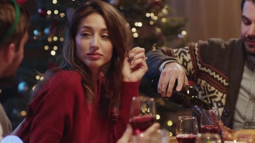 Friends Enjoy Christmas Dinner in Warm Home Setting