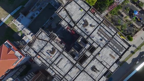 Aerial View Construction Site with Workers on Building