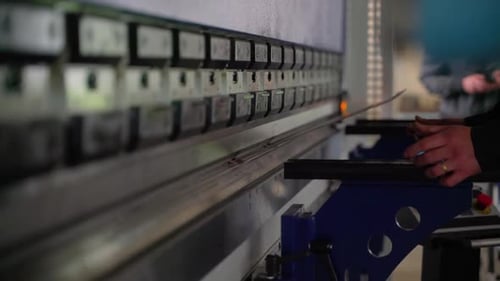Worker in factory using hydraulic
