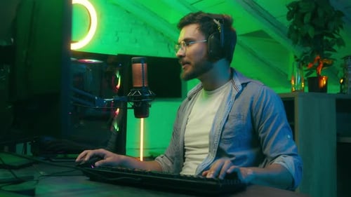 Young Adult Gaming Online, Speaking into Microphone
