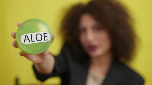 Woman Holds Aloe Vera Product Close Up