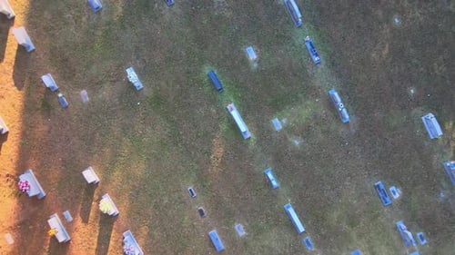 Ascending overhead shot of tombstones in a cemetary