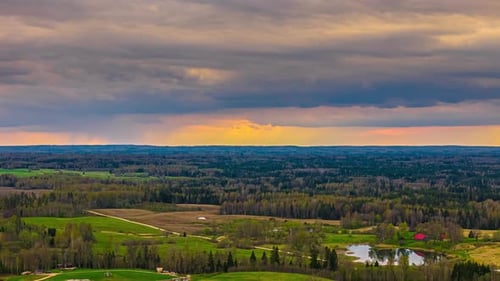 Dramatic Landscape of Fields and Forests during Golden Hour