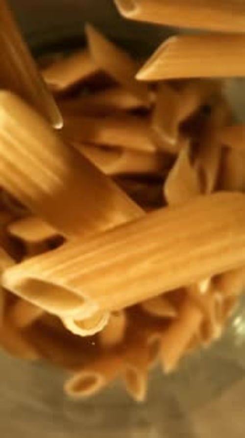 Super Slow Motion Dry Penne Pasta Filmed on a Highspeed Camera at 1000 Fps