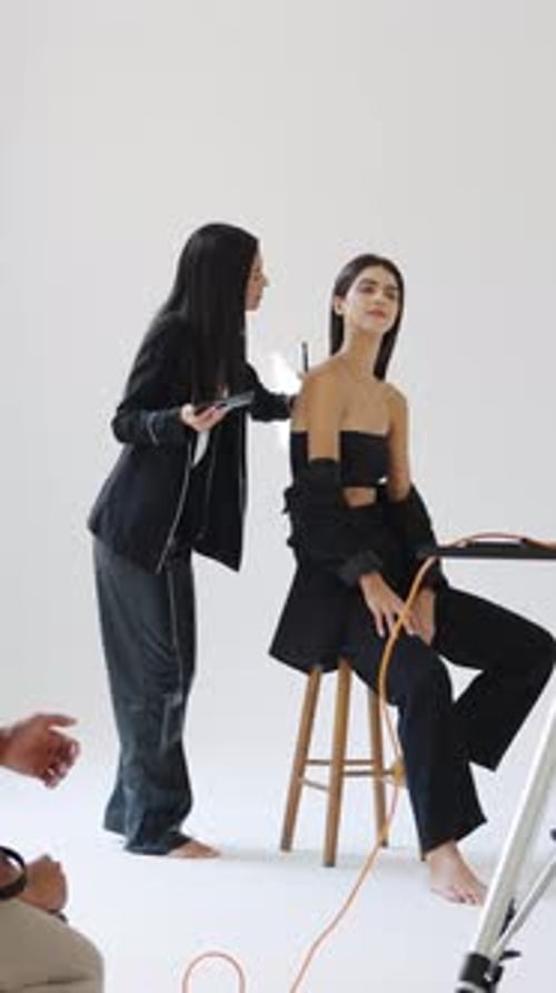 Makeup Artist Prepares Model for Fashion Shoot