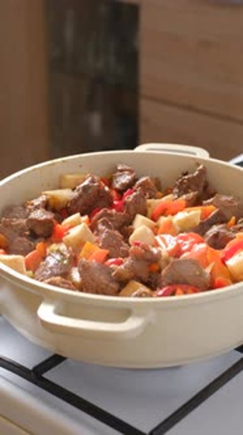 Cooking meat with red pepper and vegetable stew