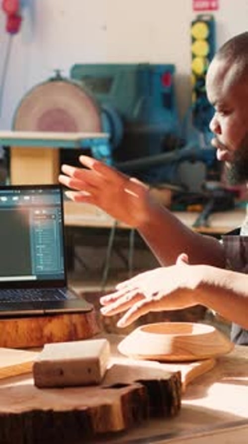Vertical Video Woodworkers Designing Custom 3D Furniture on Notebook in Studio