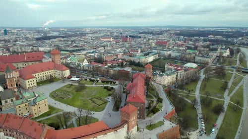 Aerial view fliying over Wawel Royal Castle by the river Vistula in the city of Krakow, Poland, with