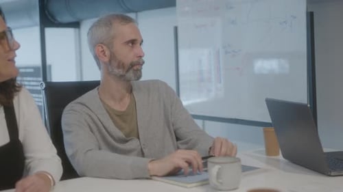 Mature Coworkers Having Business Meeting in the Office