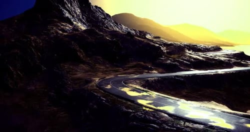 Winding Road Through Rugged Mountains at Sunset with Reflective Water Nearby